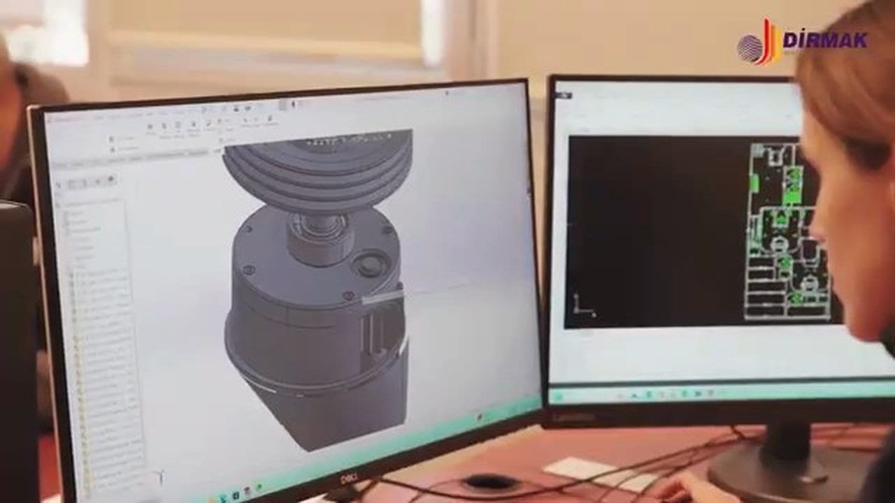 Dirmak engineering team designing a planetary mixer assembly in SolidWorks with the electrical schematic on the second screen.
